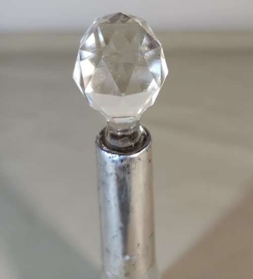 A 1910 DAVID LOEBL SCHINDLER and CO STERLING SILVER COLLAR ON A TALL CYLINDRICAL GLASS SCENT BOTTLE