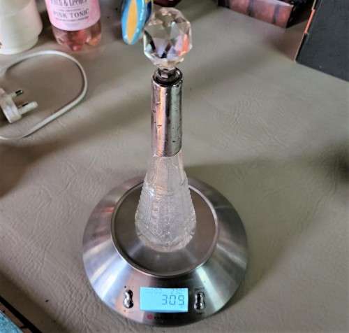 A 1910 DAVID LOEBL SCHINDLER and CO STERLING SILVER COLLAR ON A TALL CYLINDRICAL GLASS SCENT BOTTLE