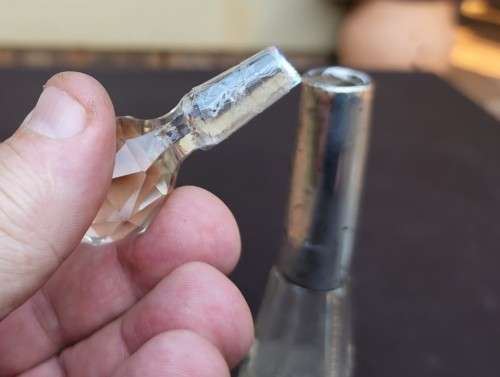 A 1910 DAVID LOEBL SCHINDLER and CO STERLING SILVER COLLAR ON A TALL CYLINDRICAL GLASS SCENT BOTTLE