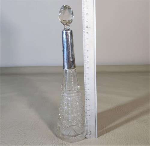 A 1910 DAVID LOEBL SCHINDLER and CO STERLING SILVER COLLAR ON A TALL CYLINDRICAL GLASS SCENT BOTTLE