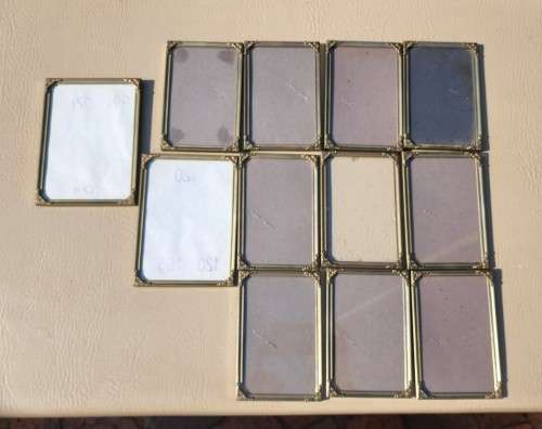 BATCH OF TWELVE (12) BRASS COLOURED METAL DESK PHOTO FRAMES