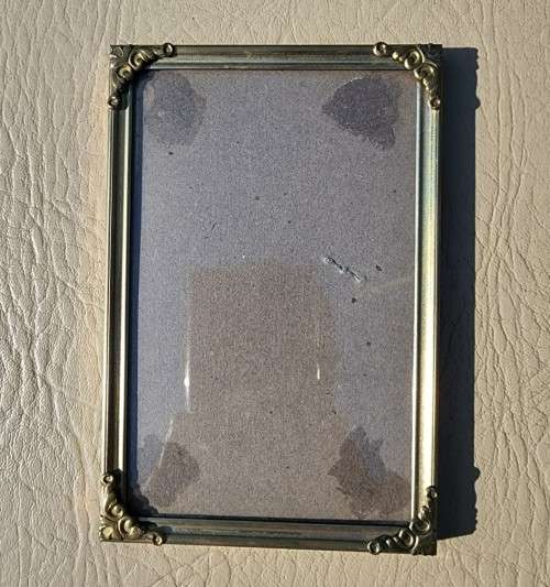 BATCH OF TWELVE (12) BRASS COLOURED METAL DESK PHOTO FRAMES
