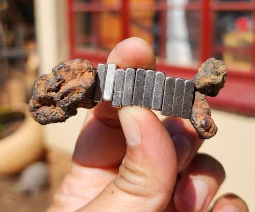 GROUP OF POSSIBLE METEORITE FRAGMENTS 4 BILLION YEARS OLD CONTAINS IRON NICKEL MAGNETIC AS SEEN IN P