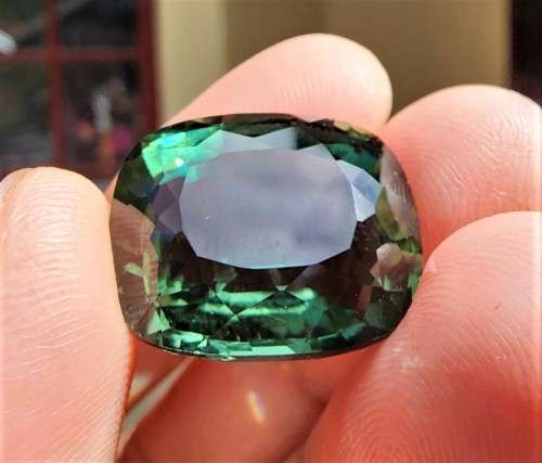 A LARGE MANMADE 24.34CARAT GREEN AMETHYST GEMSTONE WITH BEAUTIFUL CUSHION CUT