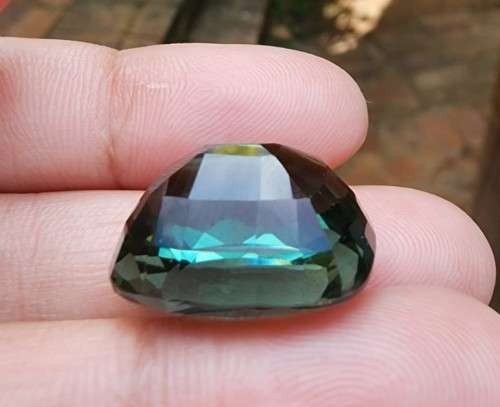 A LARGE MANMADE 24.34CARAT GREEN AMETHYST GEMSTONE WITH BEAUTIFUL CUSHION CUT