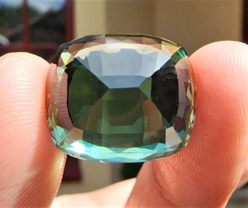 A LARGE MANMADE 24.34CARAT GREEN AMETHYST GEMSTONE WITH BEAUTIFUL CUSHION CUT