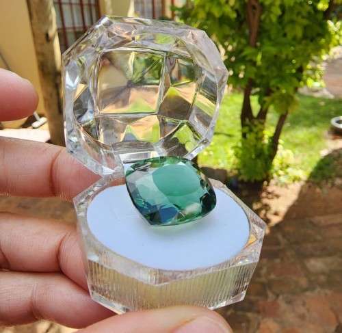 A LARGE MANMADE 24.34CARAT GREEN AMETHYST GEMSTONE WITH BEAUTIFUL CUSHION CUT