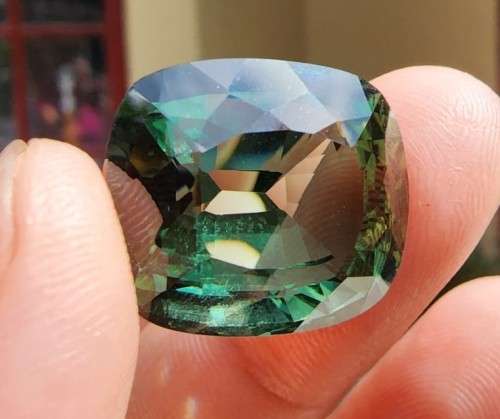 A LARGE MANMADE 24.34CARAT GREEN AMETHYST GEMSTONE WITH BEAUTIFUL CUSHION CUT