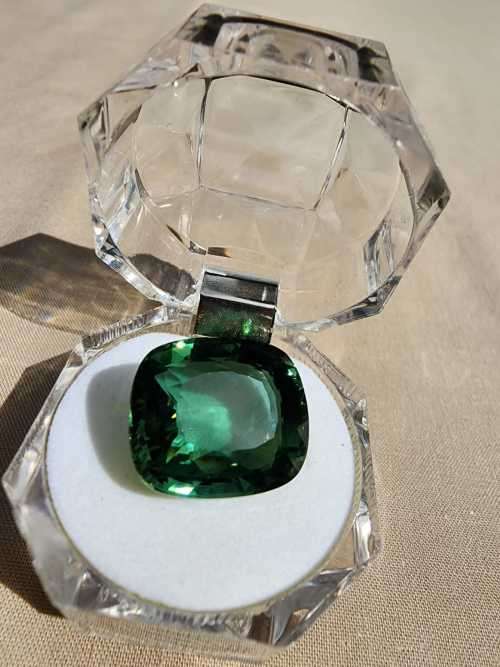 A LARGE MANMADE 24.34CARAT GREEN AMETHYST GEMSTONE WITH BEAUTIFUL CUSHION CUT