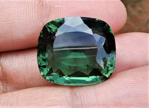 A LARGE MANMADE 24.34CARAT GREEN AMETHYST GEMSTONE WITH BEAUTIFUL CUSHION CUT