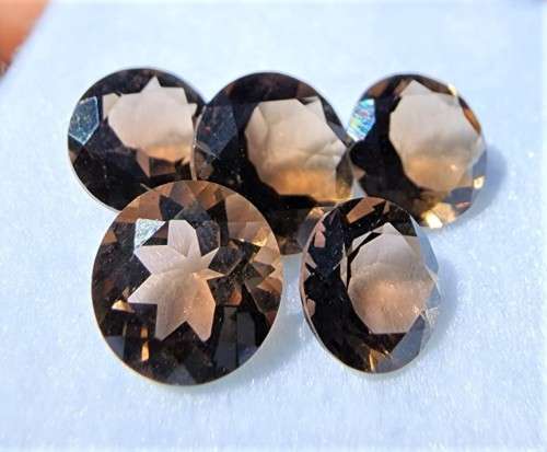 PARCEL OF 5 SMOKY QUARTZ SALMON BROWN GEMSTONES (ON AVERAGE 1,85CT)WITH ROUND CUT ONE BID TAKES ALL!