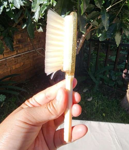 A 1950S DRESSER BOX SET WITH EMBROIDERED HAIR BRUSH AND COMB