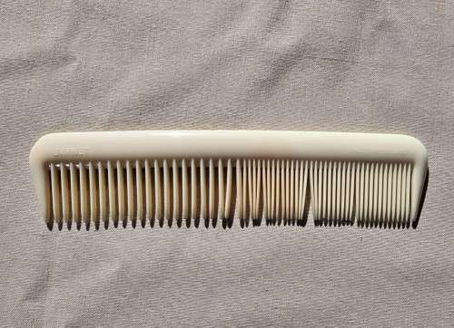 A 1950S DRESSER BOX SET WITH EMBROIDERED HAIR BRUSH AND COMB