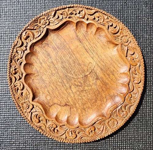 ORIENTAL TEAK COFFEE TABLE  CIRCULAR TOP WITH CARVED FLORAL BORDER AND FOLDING TRIPOD FEET