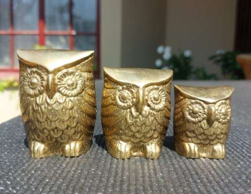 A FAMILY OF BRASS OWLS