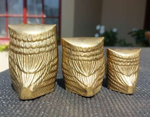 A FAMILY OF BRASS OWLS