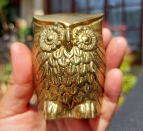 A FAMILY OF BRASS OWLS