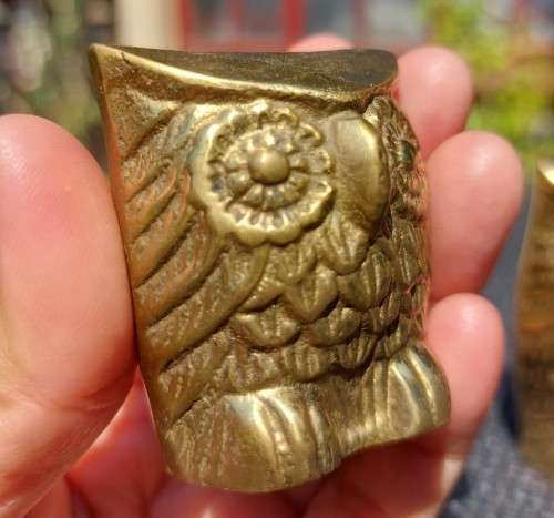 A FAMILY OF BRASS OWLS