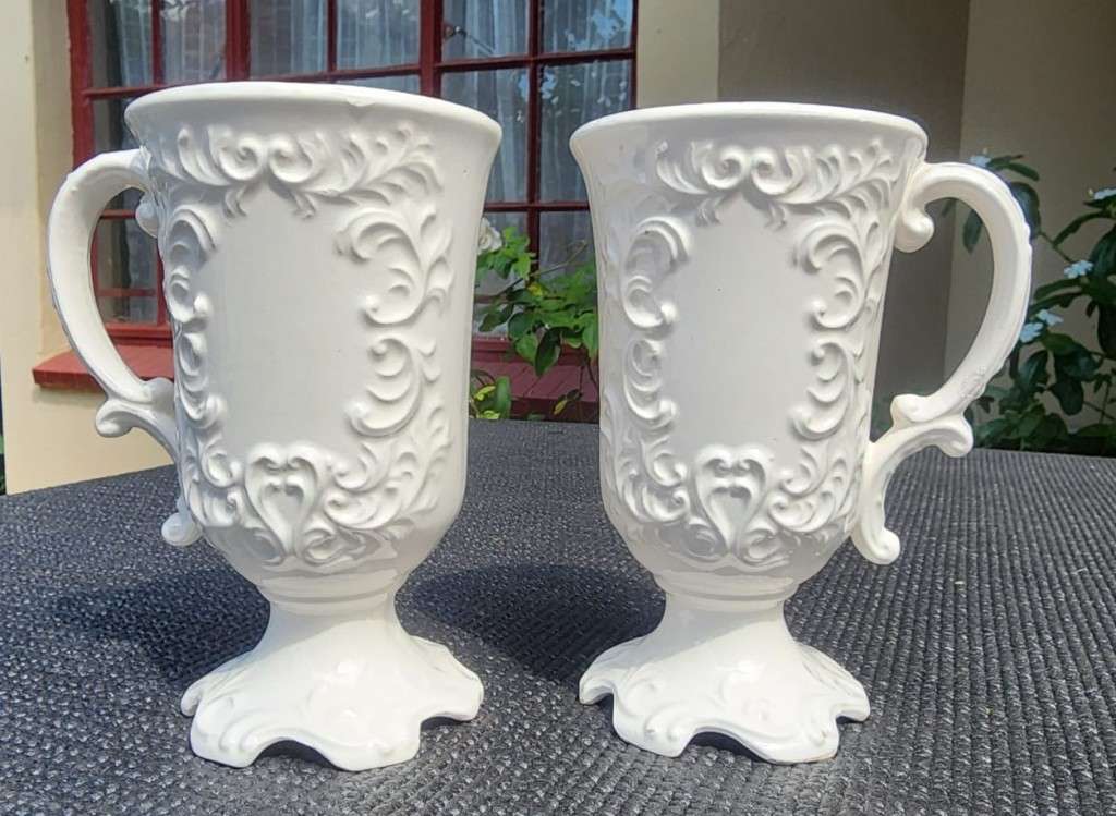 PAIR OF BALBOA HANDMADE CERAMIC CHALICES WITH RAISED FOILAGE AND FLOWER DESIGN
