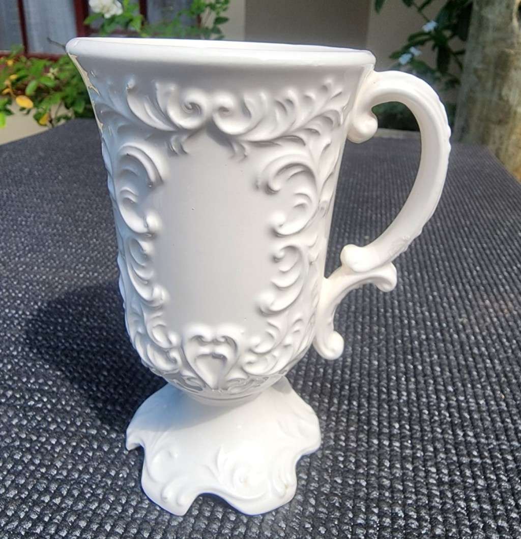 PAIR OF BALBOA HANDMADE CERAMIC CHALICES WITH RAISED FOILAGE AND FLOWER DESIGN