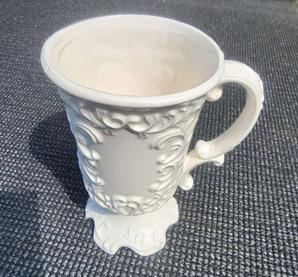 PAIR OF BALBOA HANDMADE CERAMIC CHALICES WITH RAISED FOILAGE AND FLOWER DESIGN