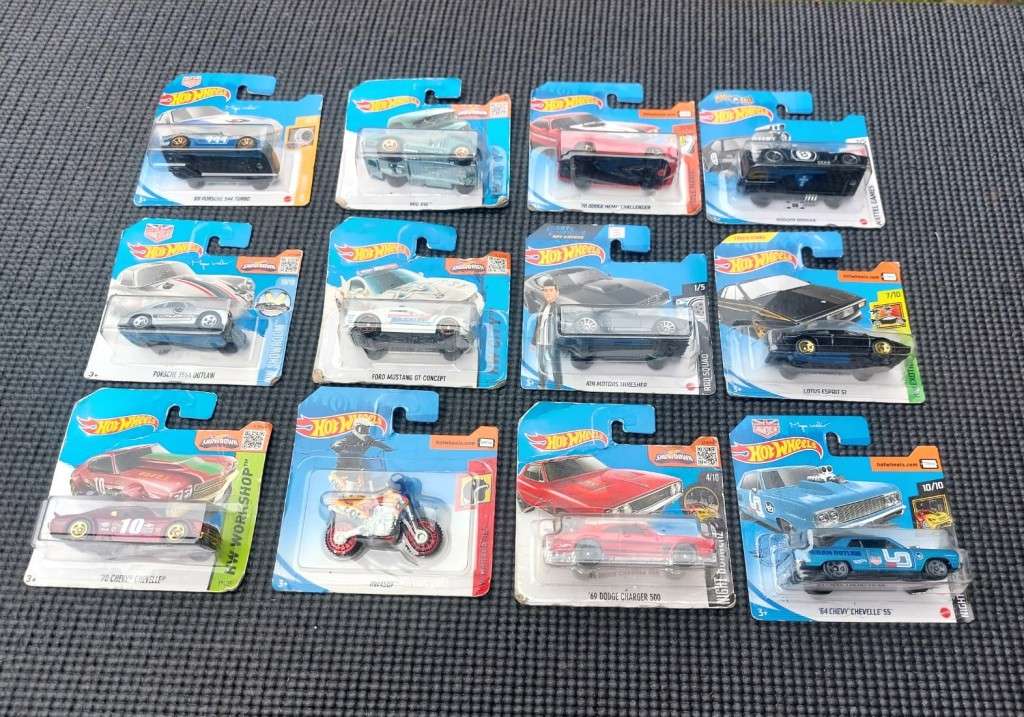 HOTWHEELS COLLECTION OF 12 DIECASTS IN ORIGINAL PACKAGING EARLY 2000 TO 2017 MODELS