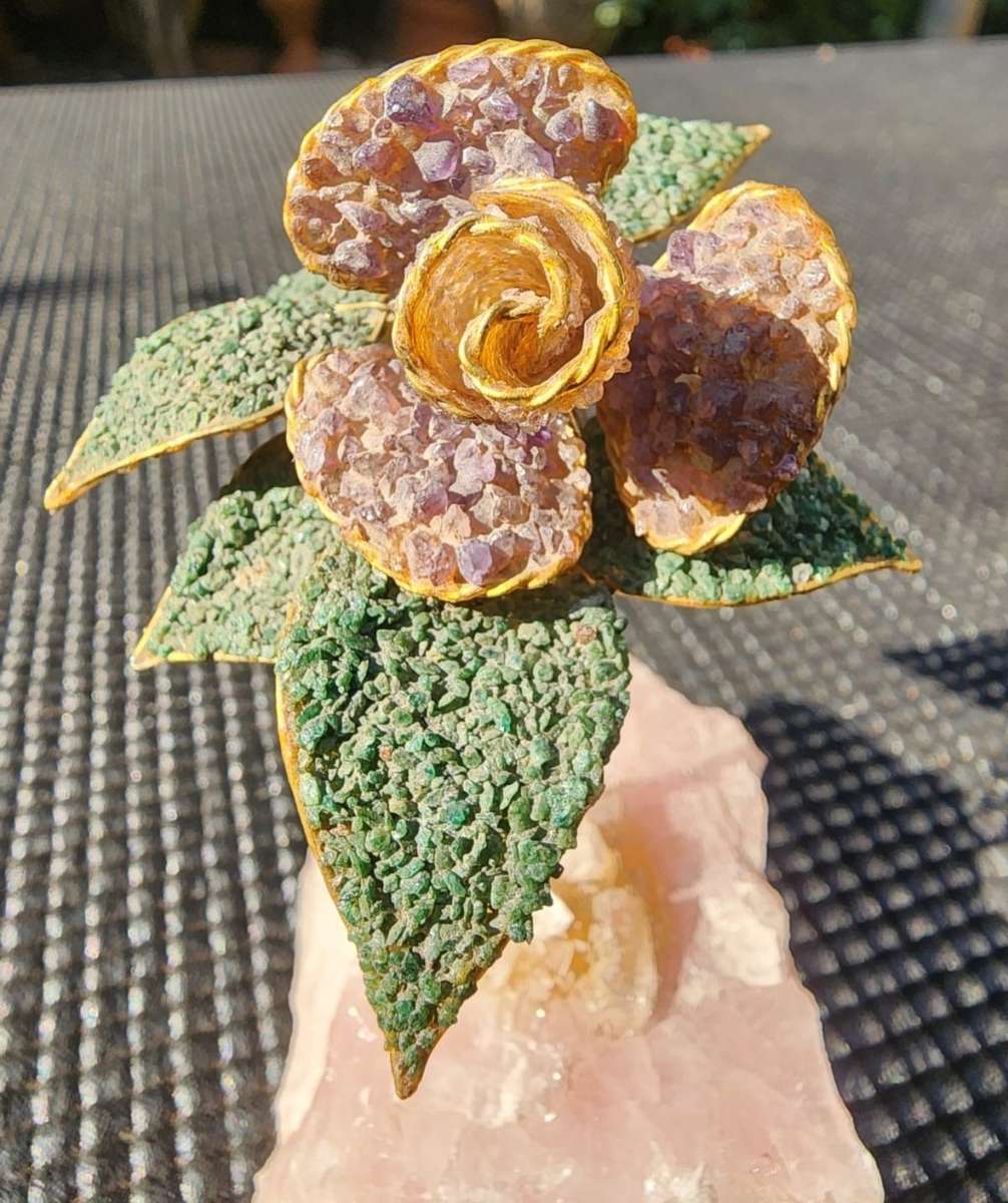 Aventurine and Rhodonite Gravel Flower with Brass Stem on Rose Quartz Slab