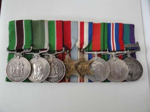 Magnificent group of 8 to Deputy Director of Rhodesian Prisons E Bottomley