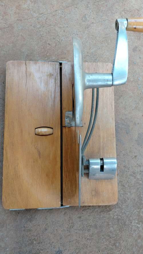 Very old wooden bread slicer