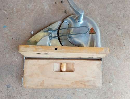 Very old wooden bread slicer