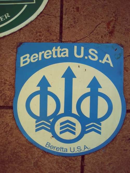 Beretta painted metal sign