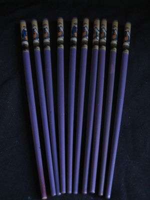 Five pairs vintage wooden chop sticks with geisha girl