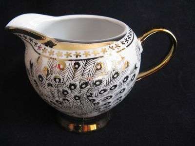 Ornate milk jug with 22ct gold finishes