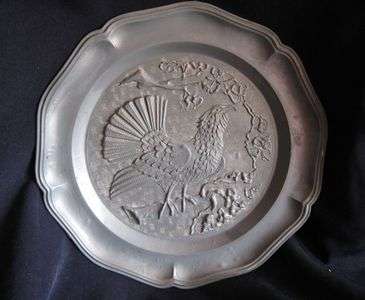 STAMPED ANTIQUE PEWTER WALL PLATE WITH FALCON