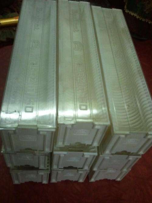 Empty 35mm slide cases.