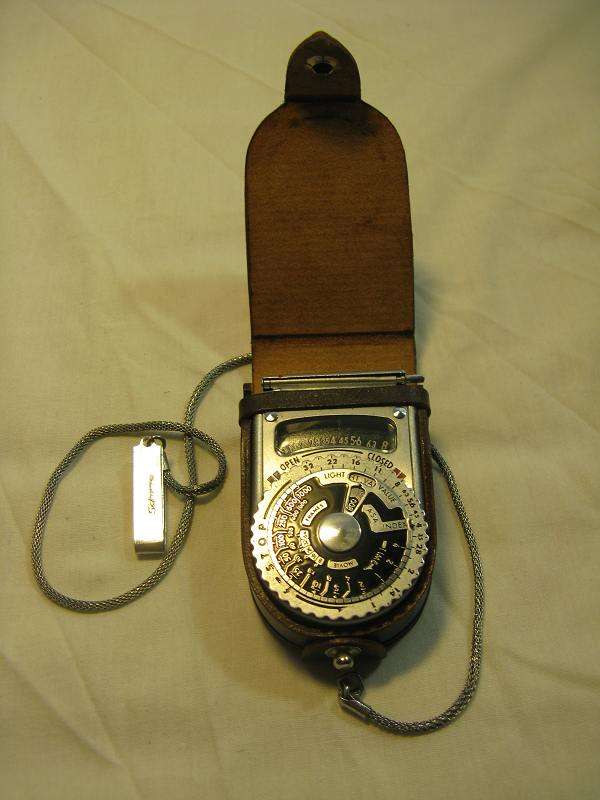 SEKONIC L-VI LIGHT METER WITH LEATHER CASE AND CHAIN CLIP, MADE IN JAPAN.