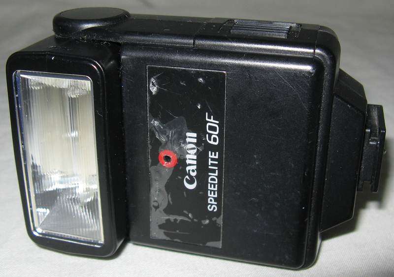 CANON SPEEDLITE 60F FLASH MADE IN HONG KONG. SOLD AS PARTS. NOT WORKING. L 11cm x W 6.3cm.