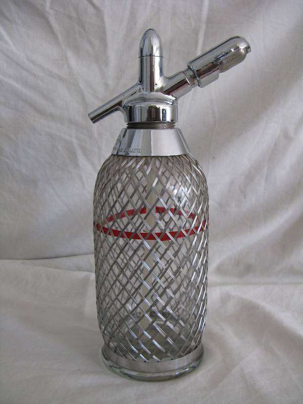 NTG MESH COVERED SODA SYPHON. H 28.5cm.