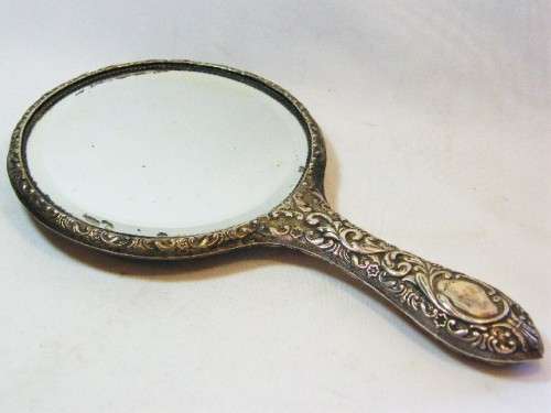 Antique sterling silver hand mirror - hallmarked but unclear