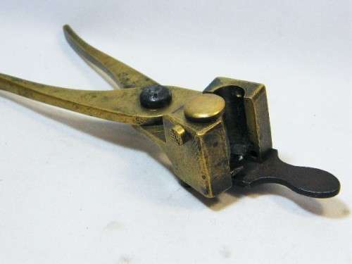 Antique brass bullet mould - marked no.577