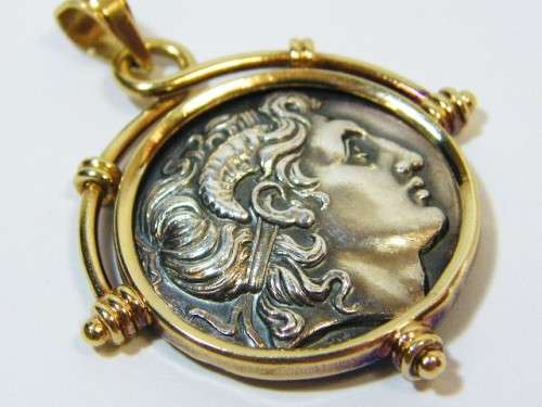 14kt Gold pendant with silver coin - weighs 10.7 grams
