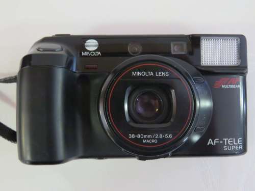 Minolta AF-Tele super 35mm camera - works with battery - Still goes on - With booklet