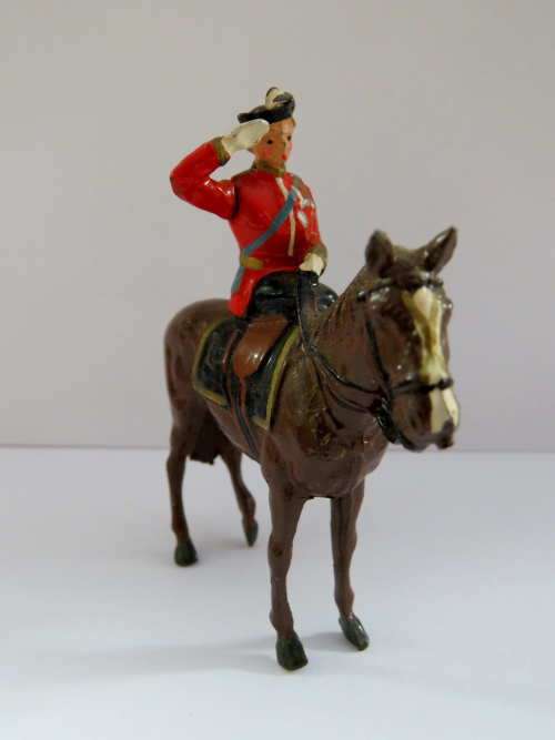 Queen Elizabeth II on horse - lead toy soldier