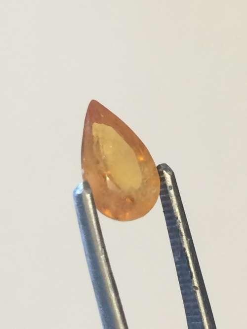Orange yellow teardrop Sapphire with inclusions