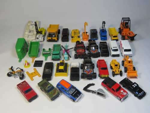 Large lot of assorted toys - Cars, trucks, etc.