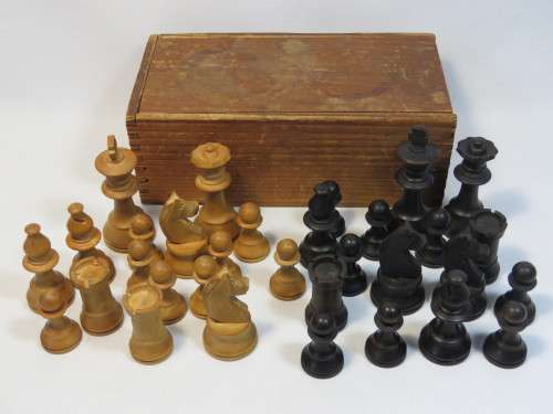 Vintage set of wooden chess pieces in wooden box