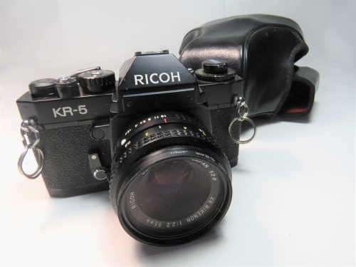 Ricoh KR-5 35mm camera with XR Rikenon 1:2.2 55mm lens -Working - Only small spot on lens