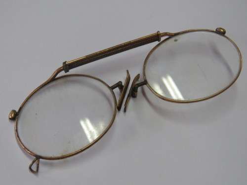 Pair of antique gold plated clip on reading glasses