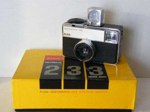 Kodak Instamatic 233 camera in original box with instruction booklet, original strap and flash