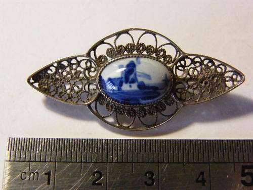 Silver filigree and Delft brooch